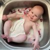 baby with wash cloth