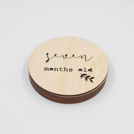 seven month old wooden milestone disc