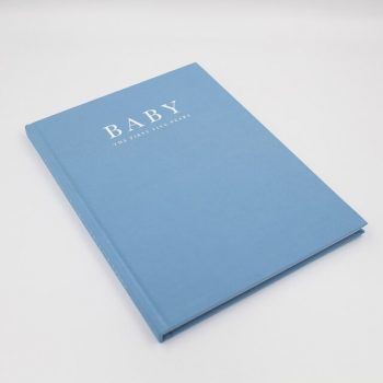 Baby memory book in blue with the first five years inscribed