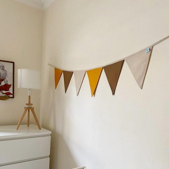 Mustard, Burnt Almond, and Oatmeal nursery bunting hanging up