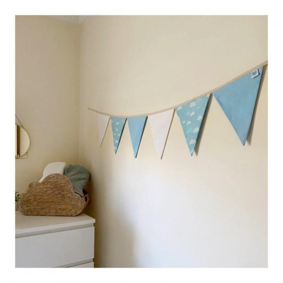 White, clouds, and blue nursery bunting hanging