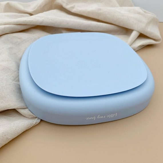 Plate made from silicone with suction cup in baby blue colour bottom view of the suction cup