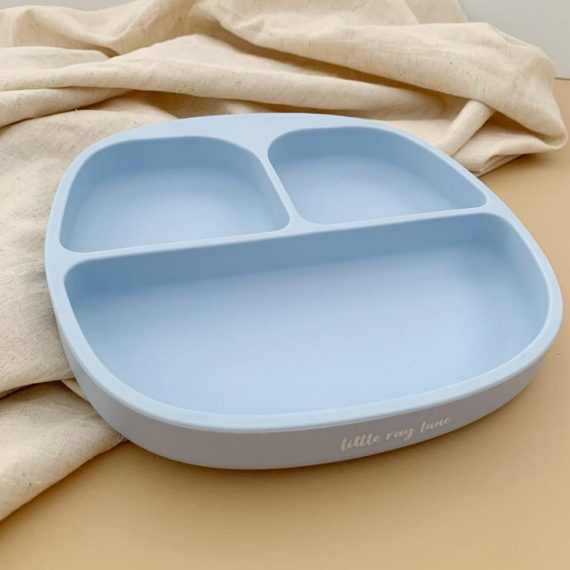 Suction plate in baby blue colour made from silicone top view