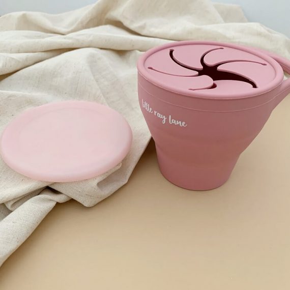 Silicone pod for holding snacks in rose colour expanded view