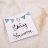 Card with baby shower writing and blue bunting