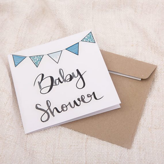 Card baby shower writing with blue bunting and an envelope