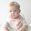 baby wearing blossoms print bib and bow