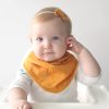 baby wearing drool bib and bow