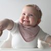 baby wearing dusty pink drool bib and bow